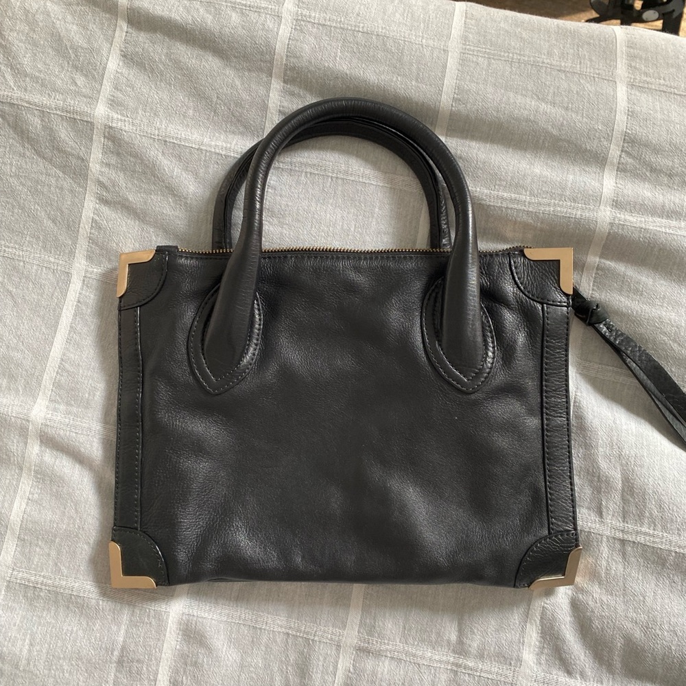 Foley + Corinna black leather hand bag